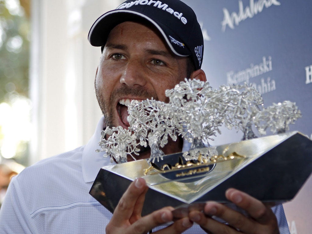 Garcia celebrating with the winner's trophy after the fourth and last stage of the Andalucia Masters on Sunday