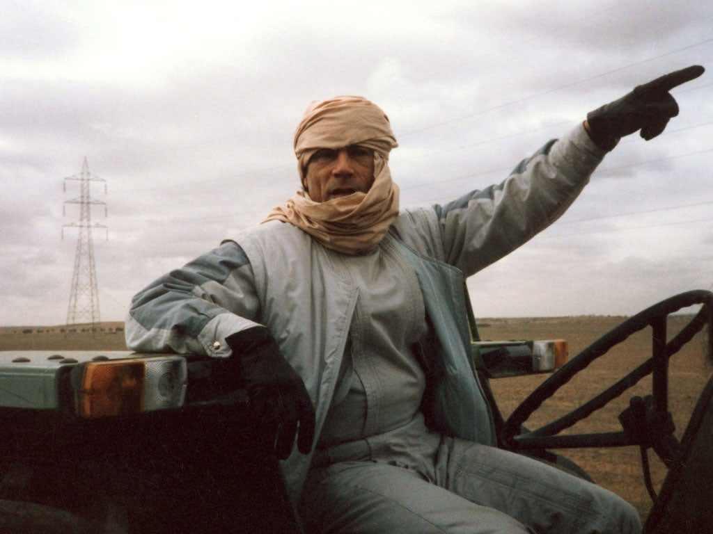 Gaddafi driving his tractor in 1986