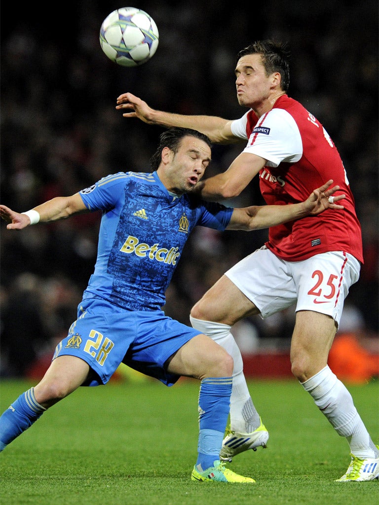 Arsenal's Carl Jenkinson, right, competes for the ball with Marseille's Mathieu Valbuena during an uneventful encounter at the Emirates