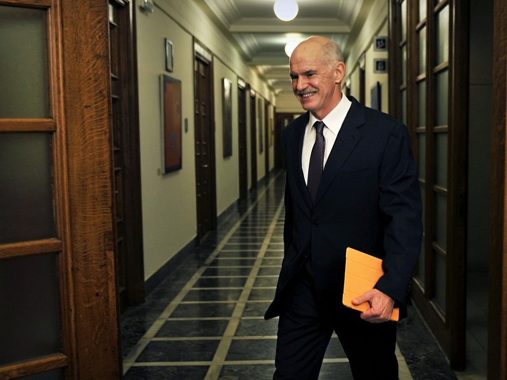 Greek Prime Minister George Papandreou arrives for a cabinet meeting in Athens