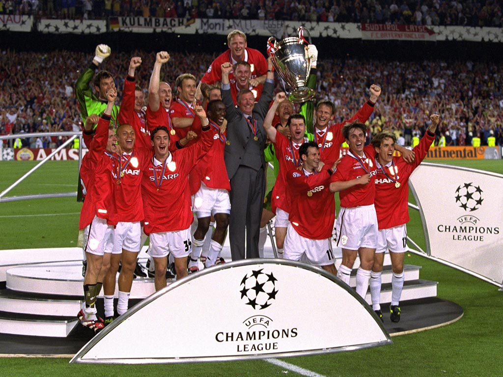 Sir Alex Ferguson celebrates winning the treble in 1999