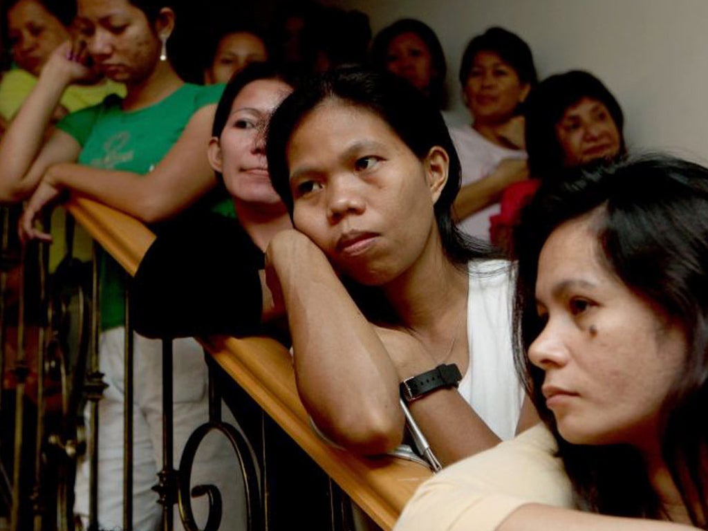 Filipino maids who have escaped from abusive employers at a Dubai refuge