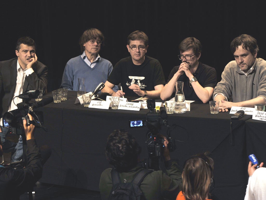 From left, Charlie Hebdo columnist Patrick Pelloux, cartoonists Plantu, Charb, Luz and Riss at an editorial
conference in Paris.