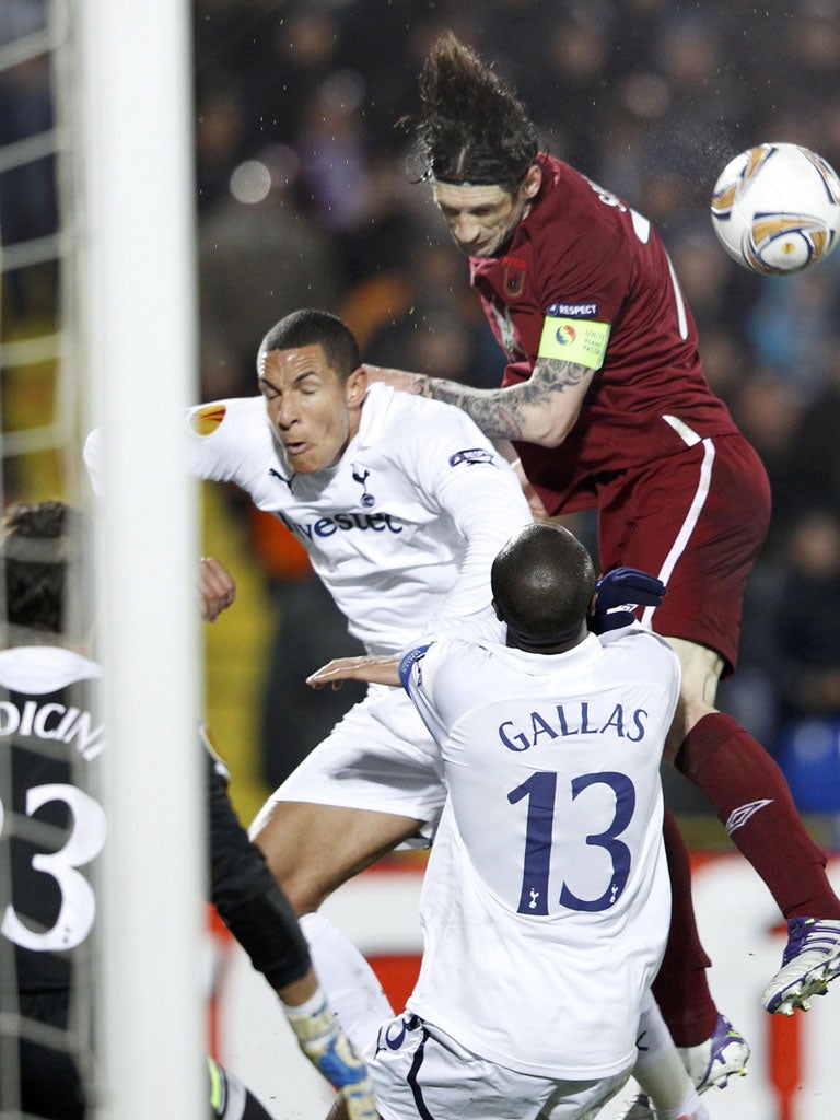 Rubin Kazan's Roman Sharonov wins a header against Spurs