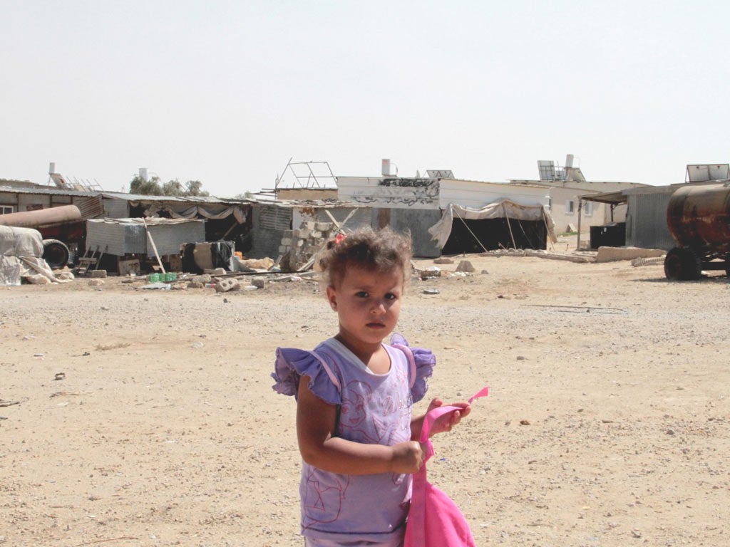 A child plays in the Bedouin town of Alsra