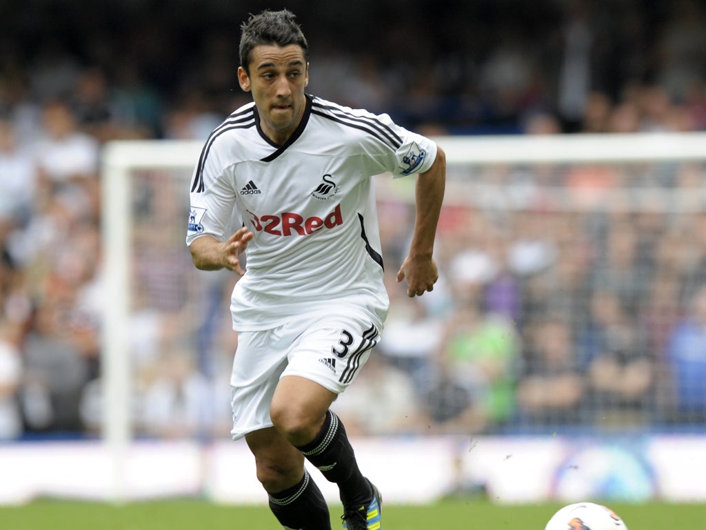 Swansea's Neil Taylor. 'The last year has been crazy,' says the
22-year-old. 'It's amazing to think I’ll have the chance of doing
it at Anfield'