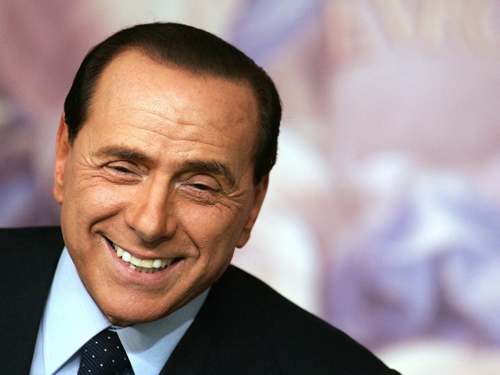 All smiles? Berlusconi now faces his biggest test