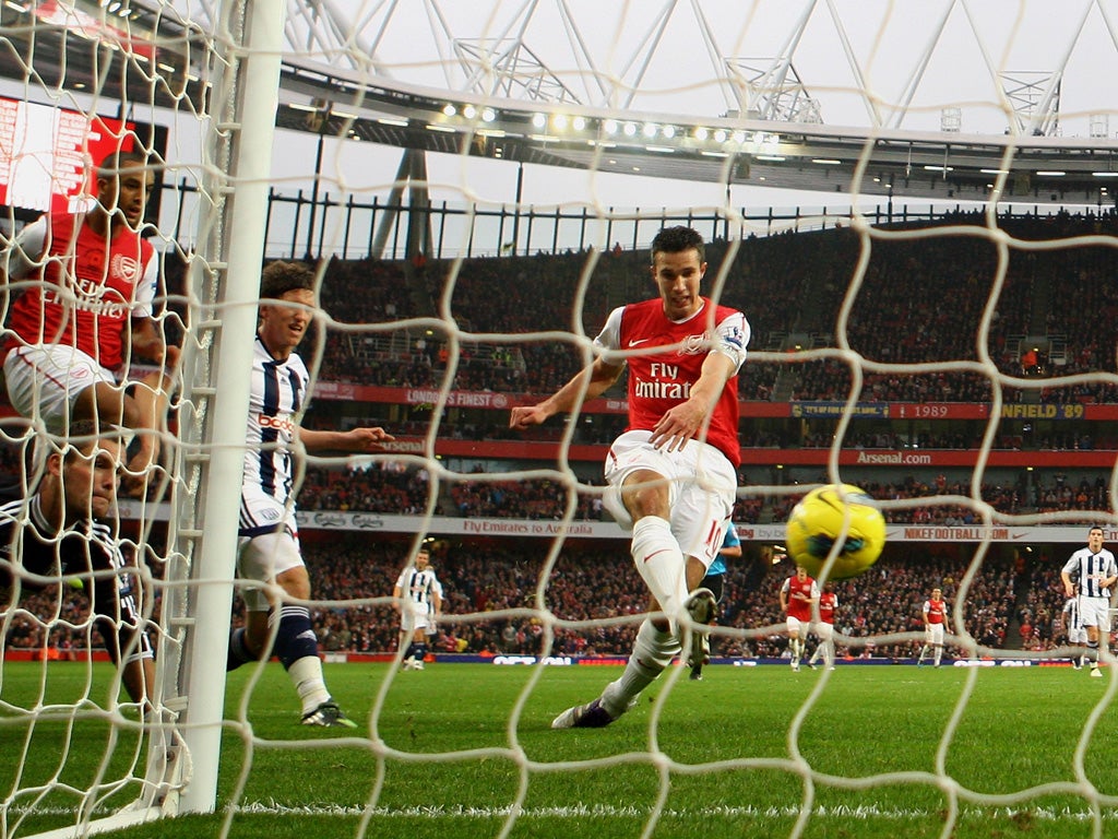 Opening salvo: Robin van Persie fires home Arsenal's first goal from close range at the Emirates yesterday