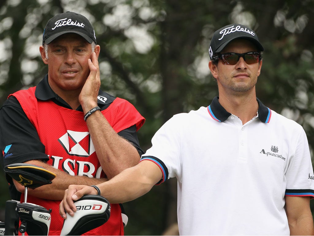 Caddie Steve Williams appears to have plenty on his mind during Adam Scott's final round in Shanghai