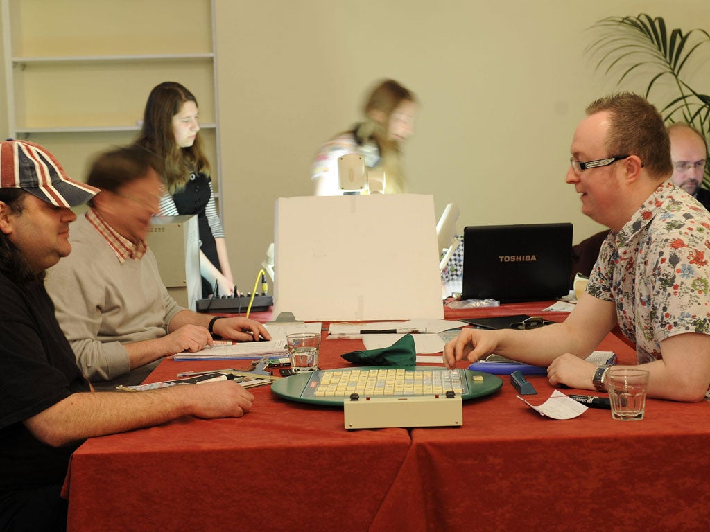 Gary Oliver, left, from Southampton, plays against the eventual winner, Wayne Kelly, from Orford in Cheshire, during the National Scrabble Championship final