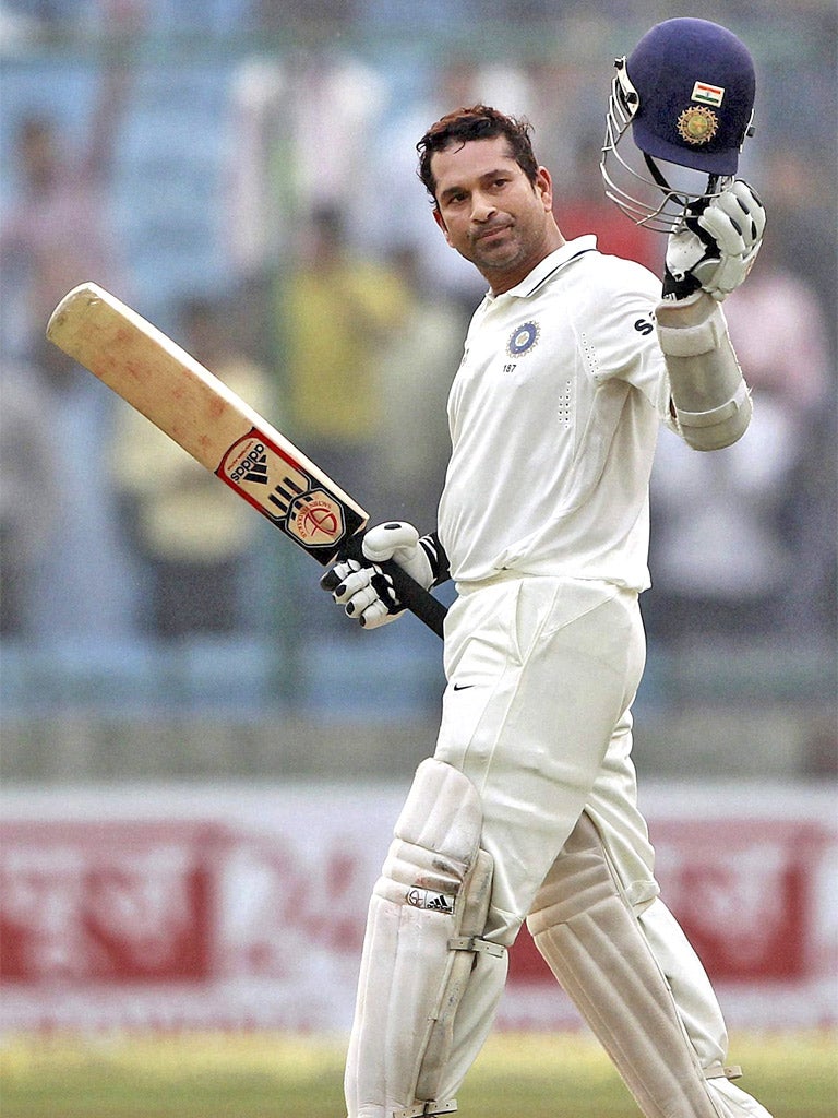 The Little Master, Sachin Tendulkar, milks the applause after reaching 15,000 Test runs