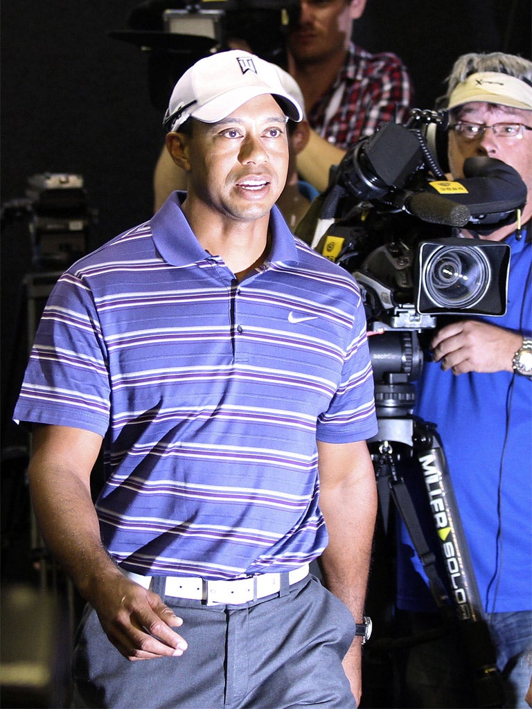 Tiger Woods says his former caddie 'is not a racist'