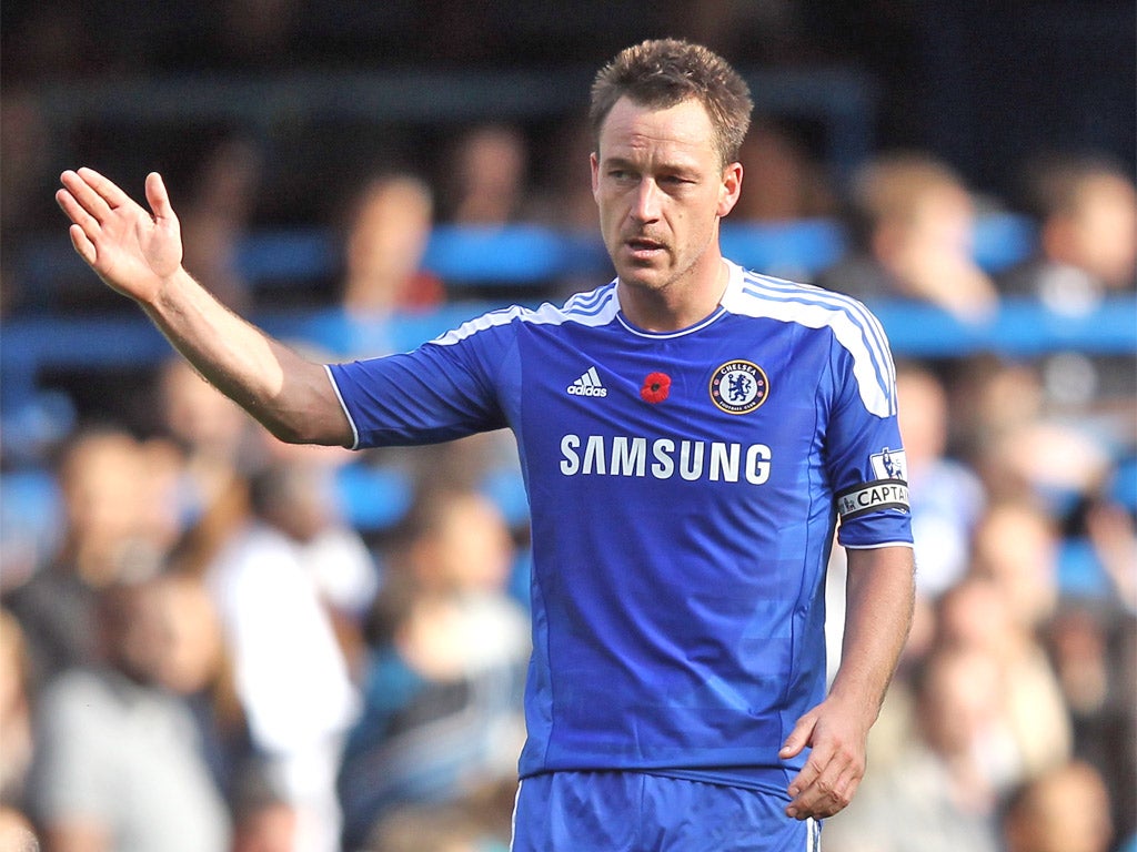 The England captain John Terry proudly wears a poppy on his
Chelsea shirt