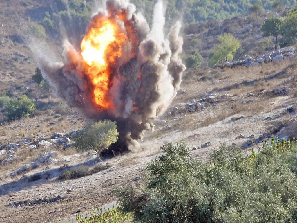 An unexploded cluster bomb is detonated in southern Lebanon. The weapons leave behind ‘bomblets’ that can kill civilians long after a war is ended