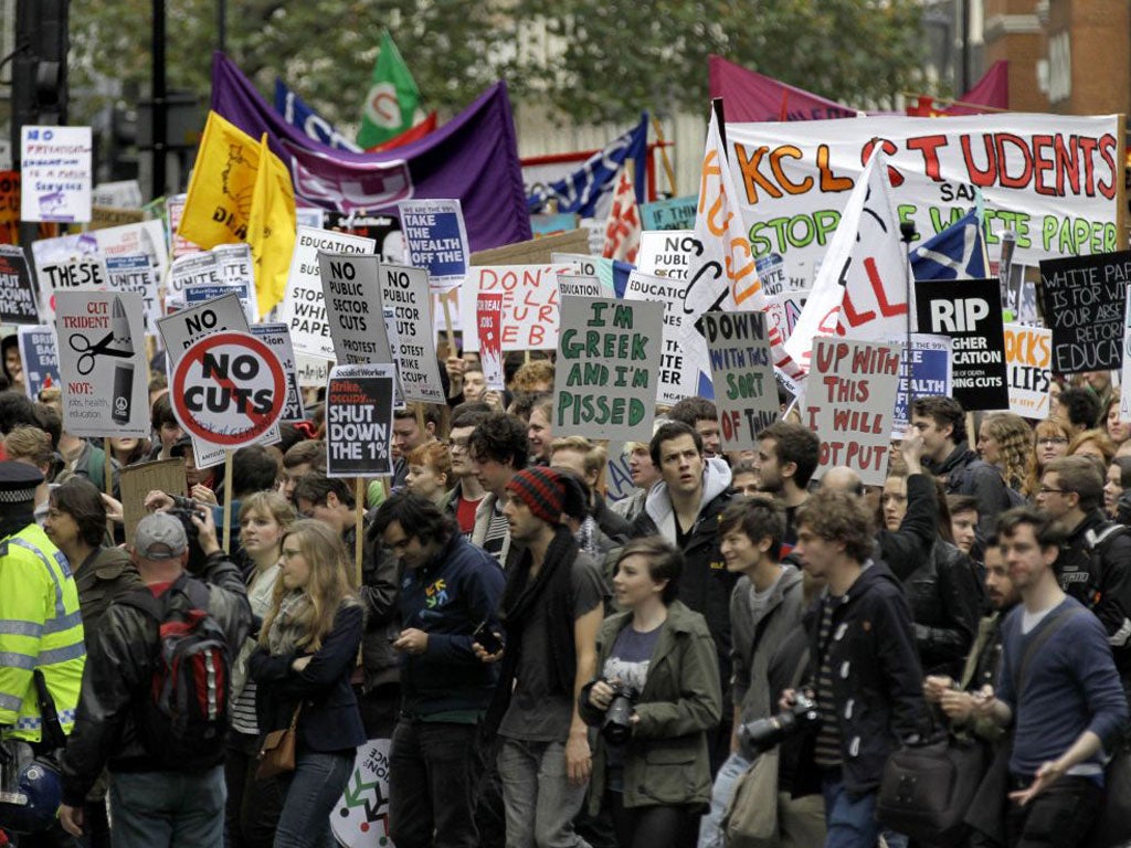 Students and campaigners march through the streets of London to protest against higher tuition fees