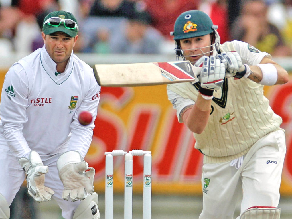 South Africa keeper Mark Boucher watches Australia captain Michael Clarke smash his way to 107 in Cape Town