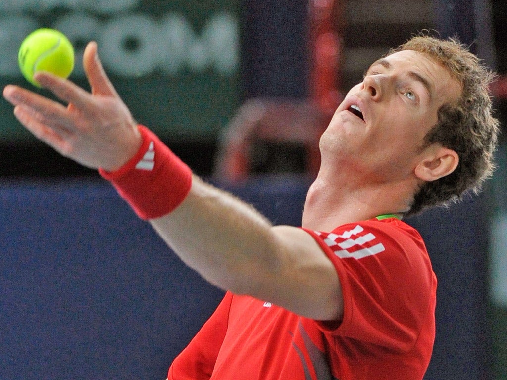 Andy Murray serves during his straight-sets first-round win yesterday