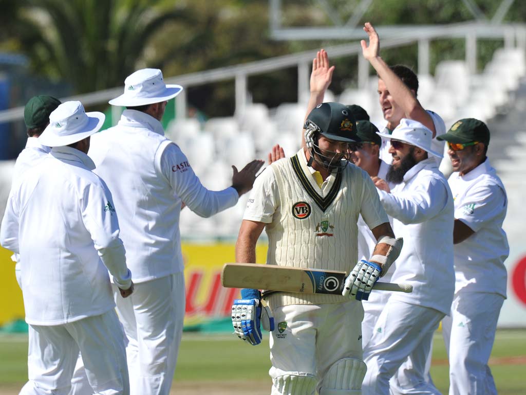 Australian batsman Shaun Marsh leaves the pitch after being dismissed