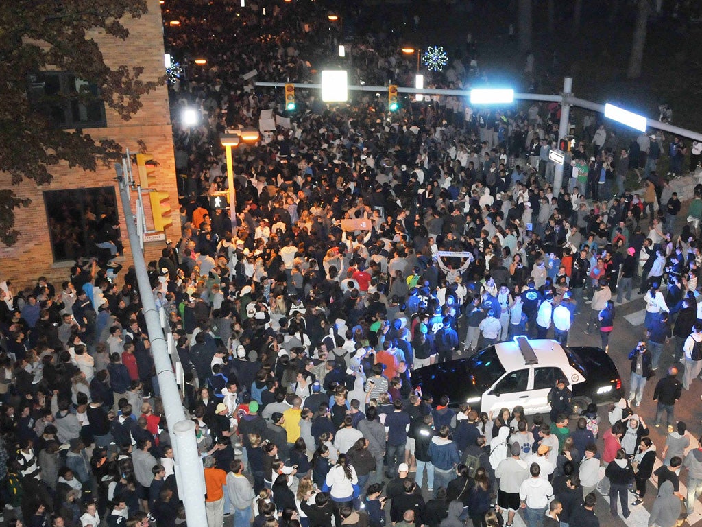 Penn State students take to the streets after Joe Paterno was sacked