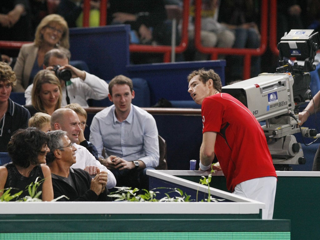 Andy Murray feels the strain during a tight three-set defeat yesterday