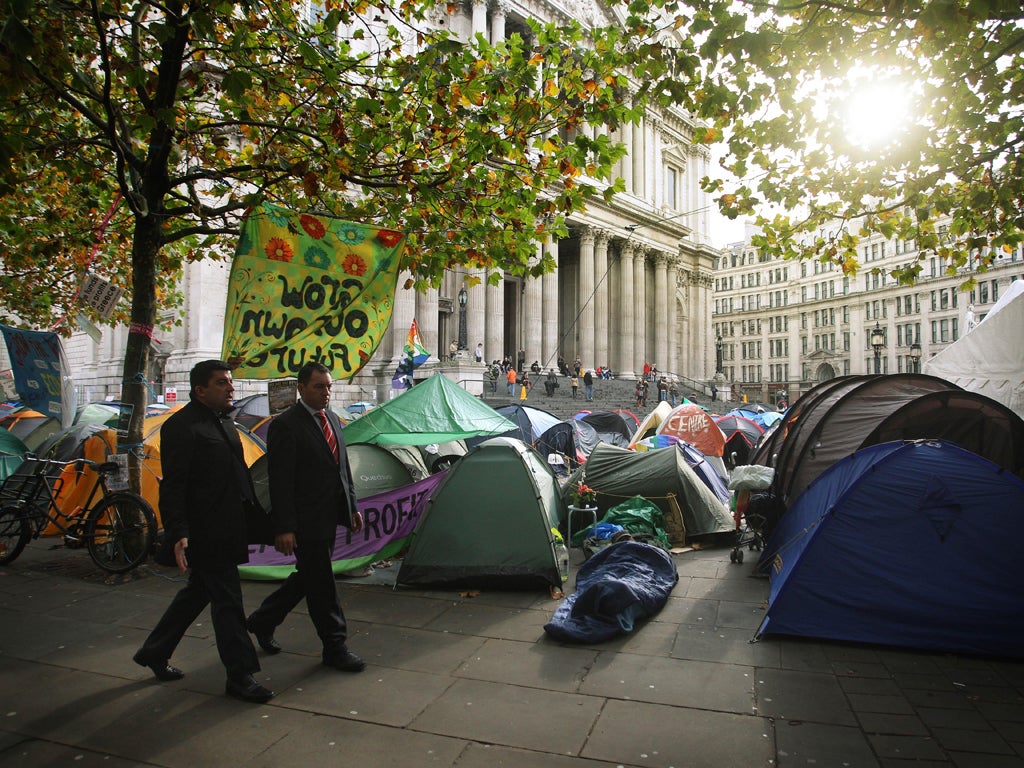 Protesters and city workers are cheek by jowl outside St Paul's but poles apart ideologically