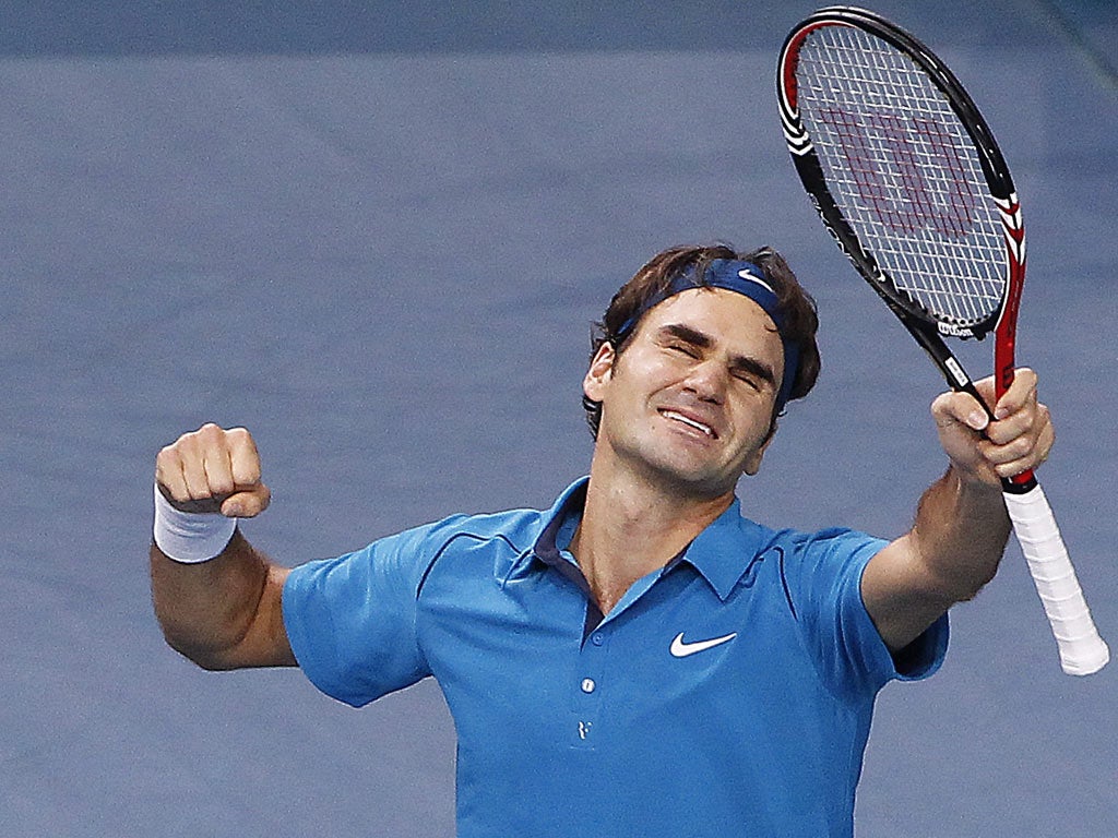 Roger Federer shows his joy after finally winning his first Paris Masters with a straight-sets victory over France's Jo-Wilfried Tsonga