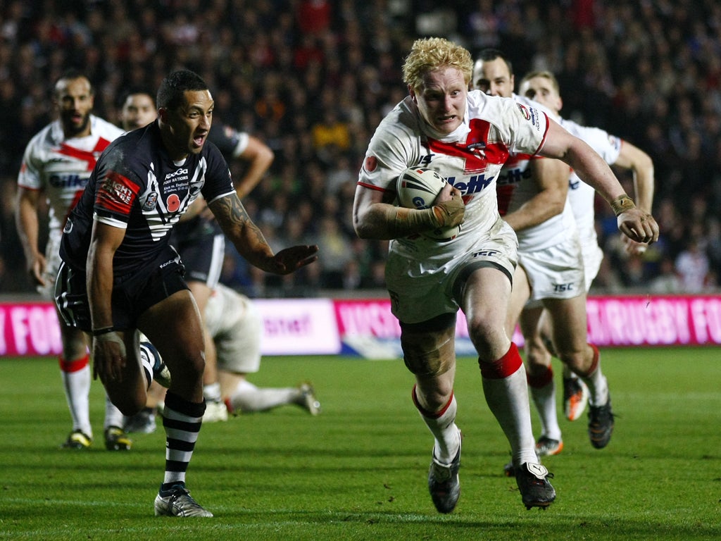 Prop James Graham (right) evades the New Zealand defence during England's impressive 28-6 win last weekend