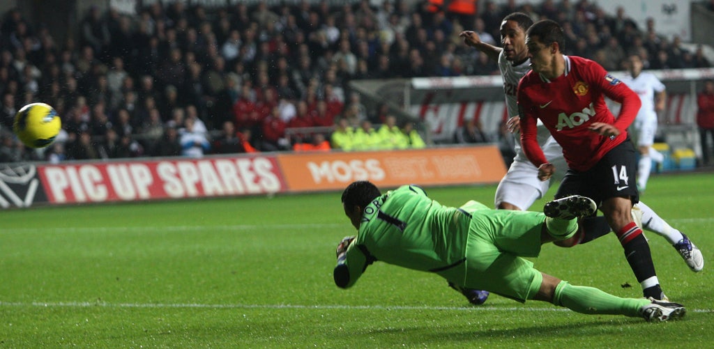 Hernandez of Manchester United scores their first goal against Swansea City's Michel Vorm