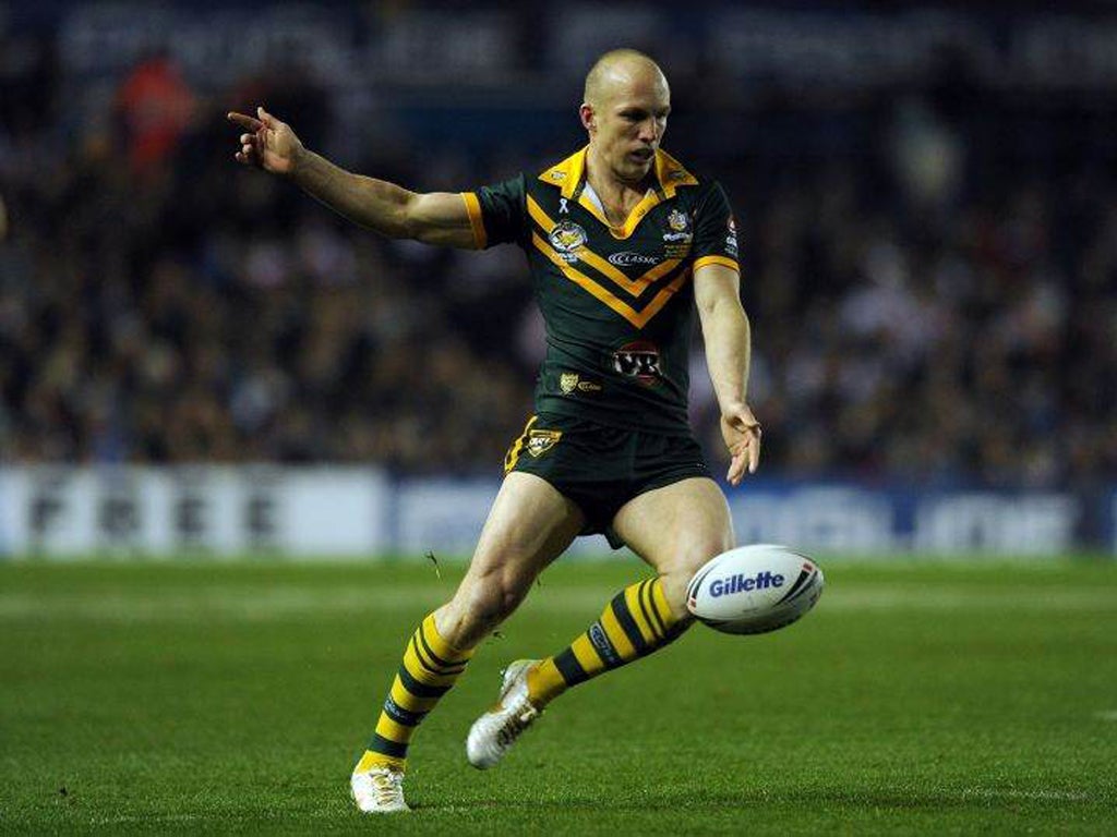 Darren Lockyer kicks during the last match of his career