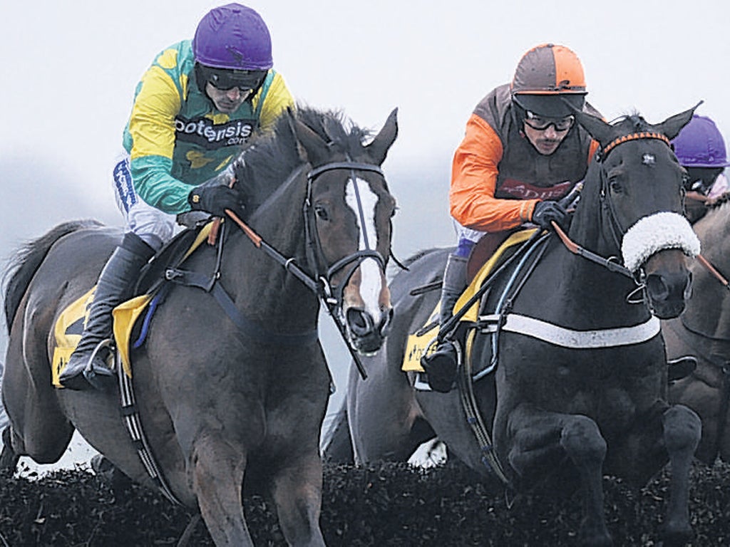 Ruby Walsh stirs the emotions by steering Kauto Star (left) to a fourth victory in the Betfair Chase