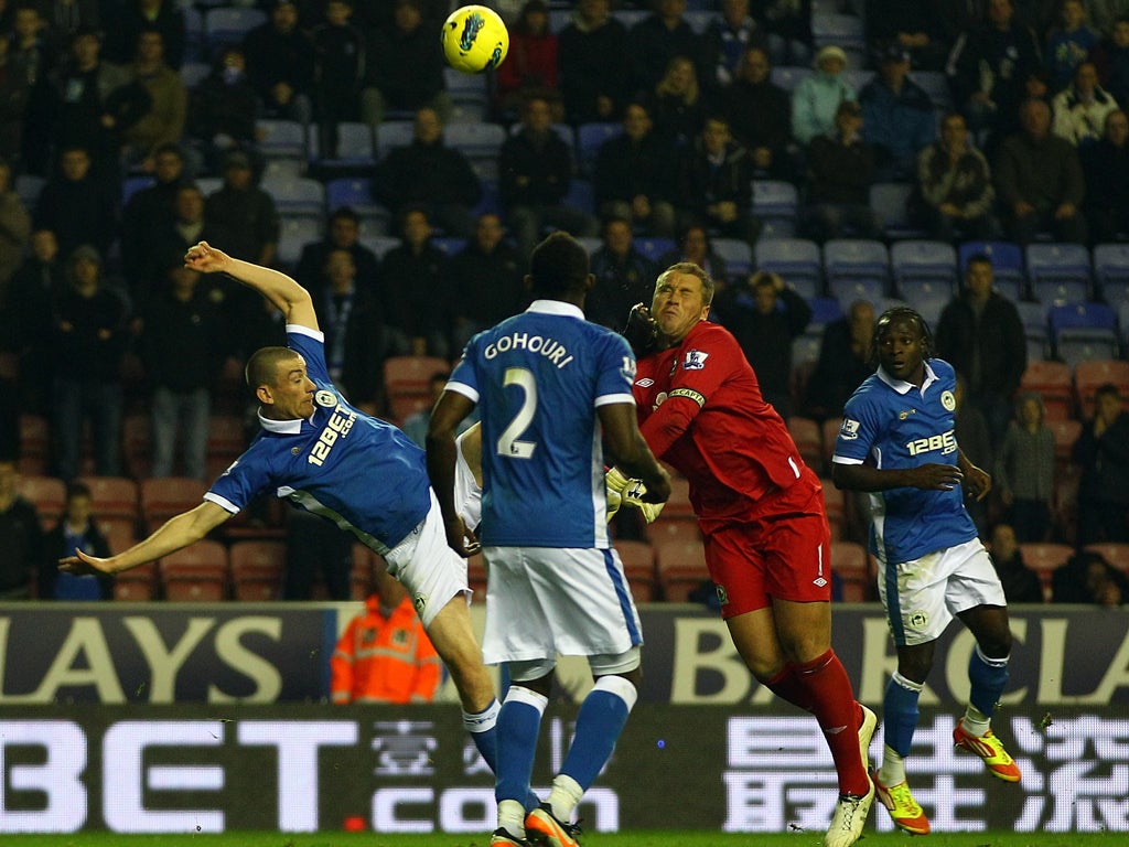 Paul Robinson, Blackburn’s goalkeeper, is kicked in the head by Wigan's David Jones to win a late penalty