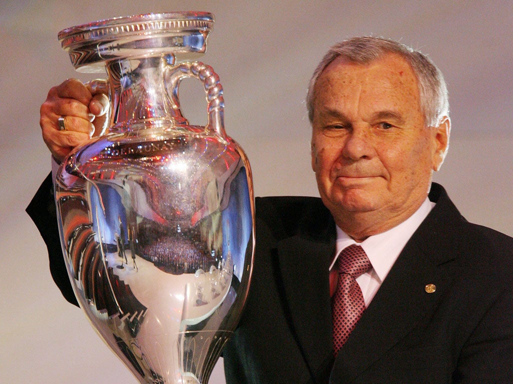 Ivanov holds aloft the European Championship trophy at the draw for next year's tournament