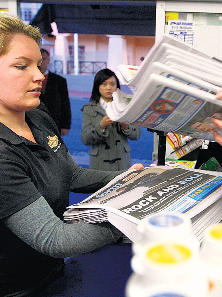 A newsagent in Sydney. Two local paid-for papers in
Australia have recently been
closed down.