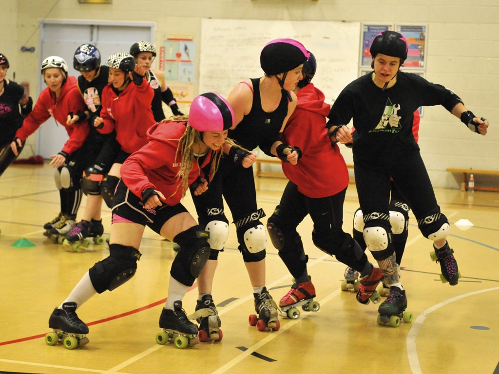 Blockers take on the jammers as the London Roller Girls train for the first ever World Cup