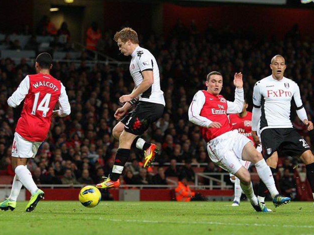 Arsenal's Thomas Vermaelen (second right) puts the ball into his own goal during an unconvincing display by the Gunners last night