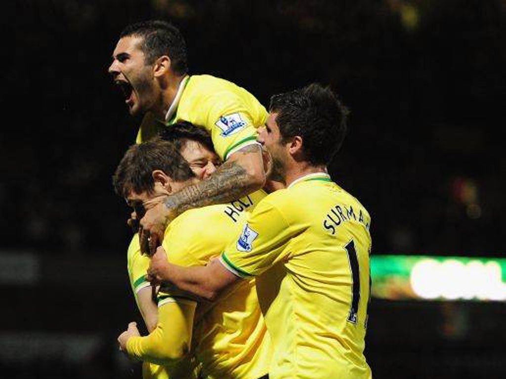 Norwich substitute Grant Holt celebrates his winner three minutes after entering the action against Queens Park Rangers at Carrow Road