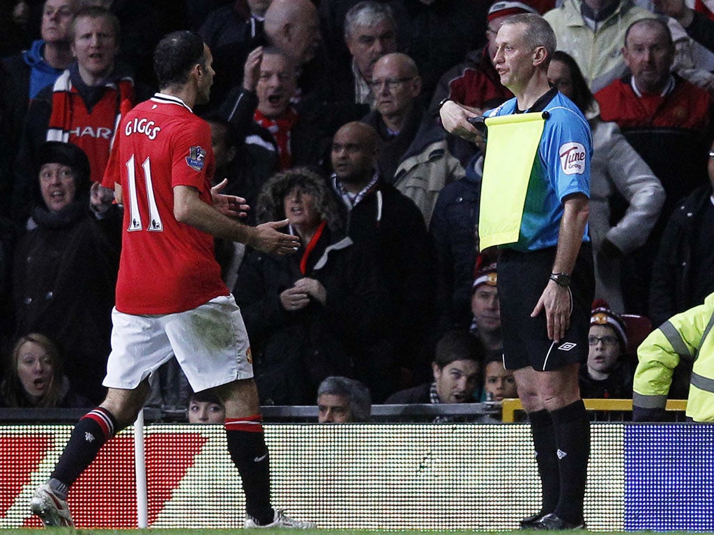 Ryan Giggs berates assistant referee John Flynn at Old Trafford on Saturday