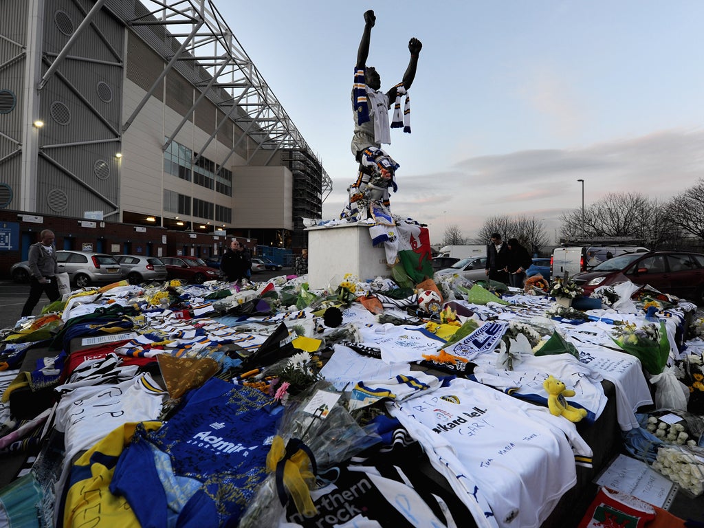 Elland Road's Billy Bremner statue is covered in scarves and flowers to mark the death of club's former player