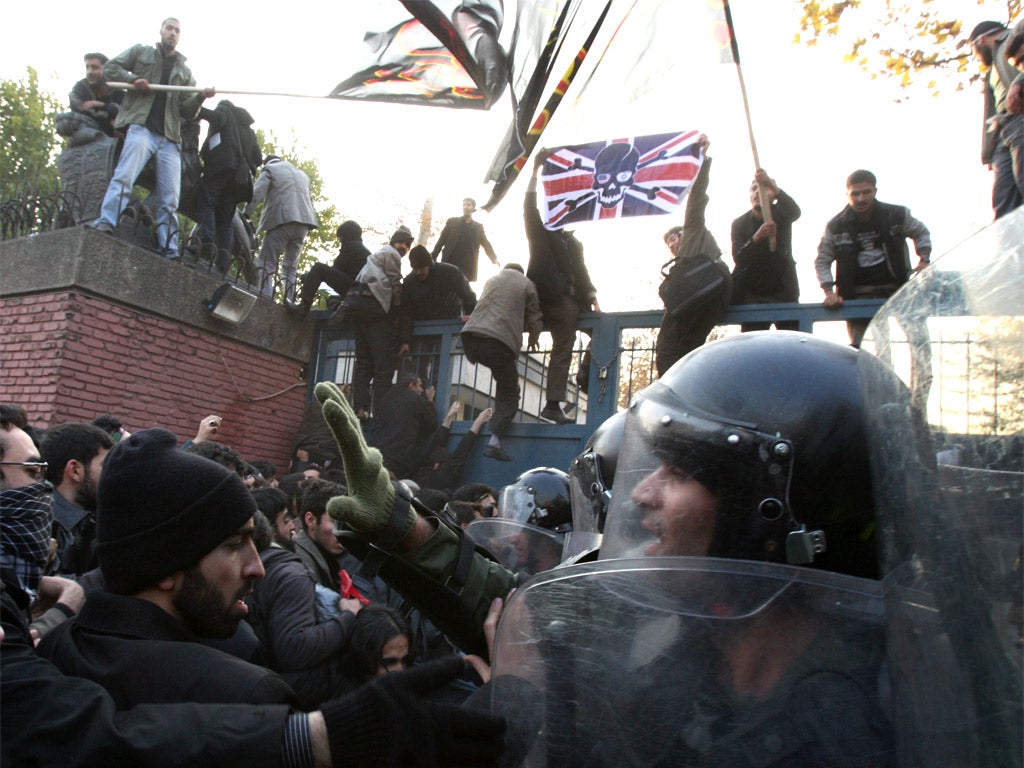 Protesters storm the British embassy in Tehran yesterday