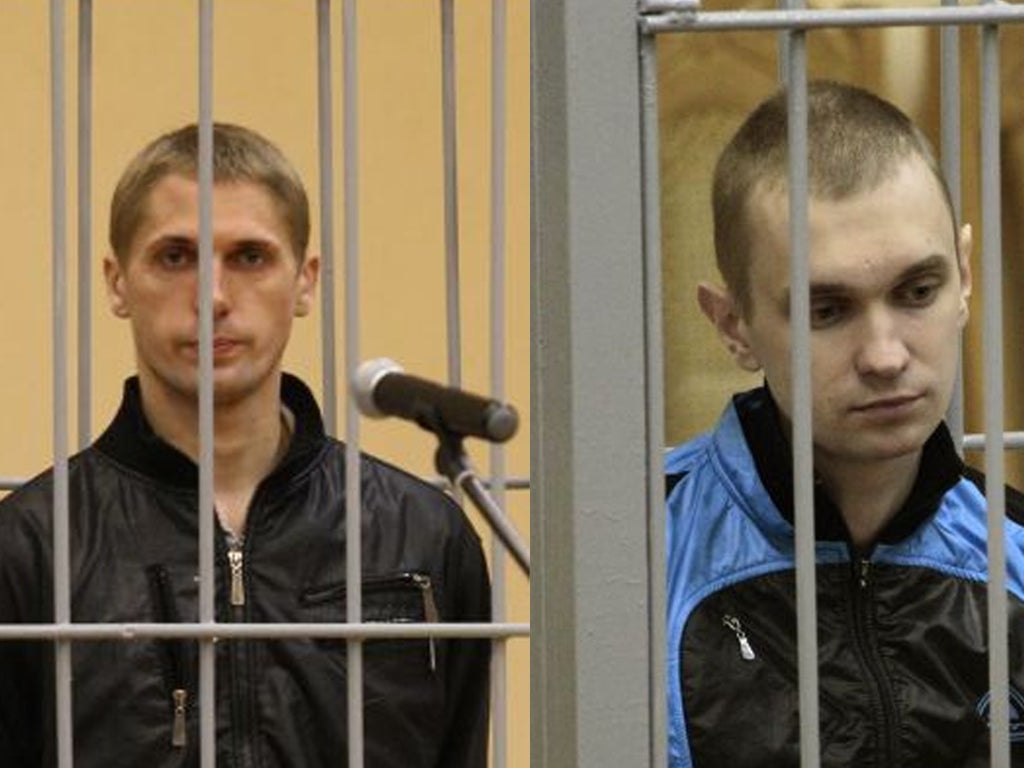 Vladislav Kovalyov, left, and Dmitry Konovalov, in the defendants’ cage during their trial in Minsk