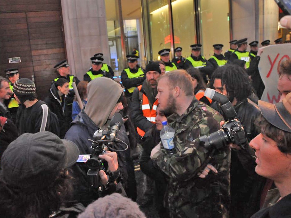 Video footage shows the man being confronted by protesters from the Occupy movement near Piccadilly Circus