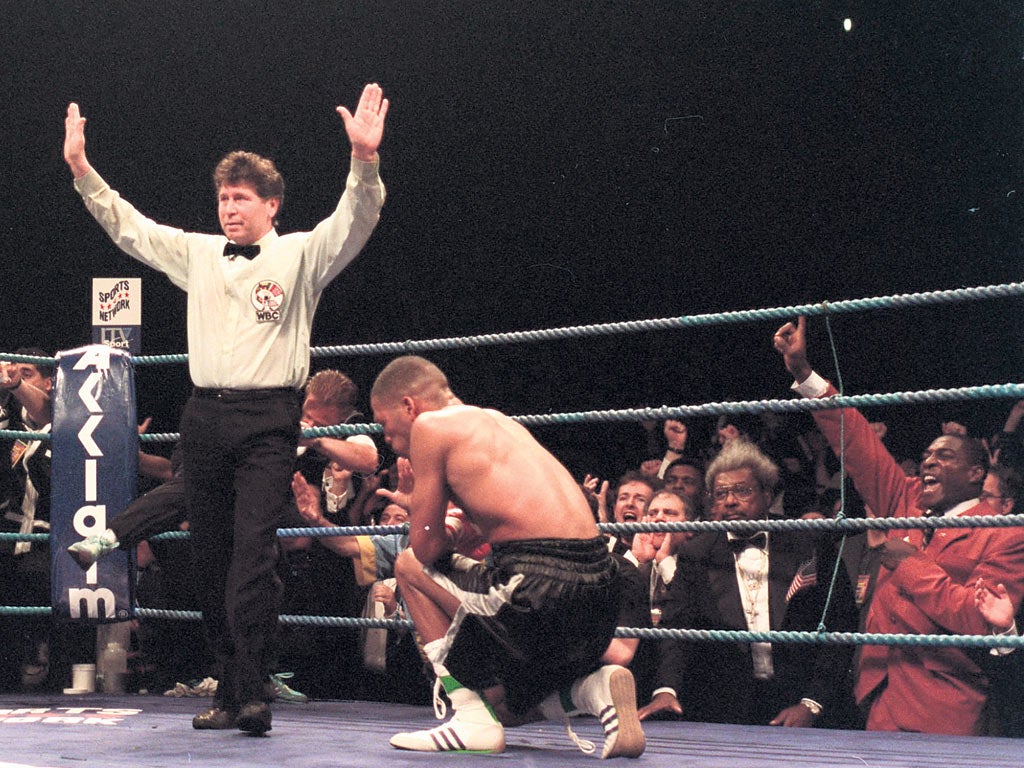 Gerald McClellan sinks to his knees in distress after defeat by Nigel Benn in one of the most brutal fights in history