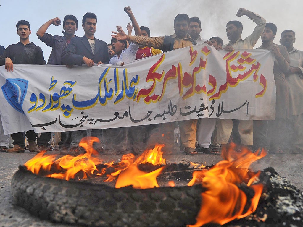 Activists shout slogans against Nato strikes during a protest