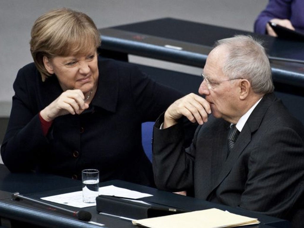 Angela Merkel with her Finance Minister Wolfgang Schauble yesterday
