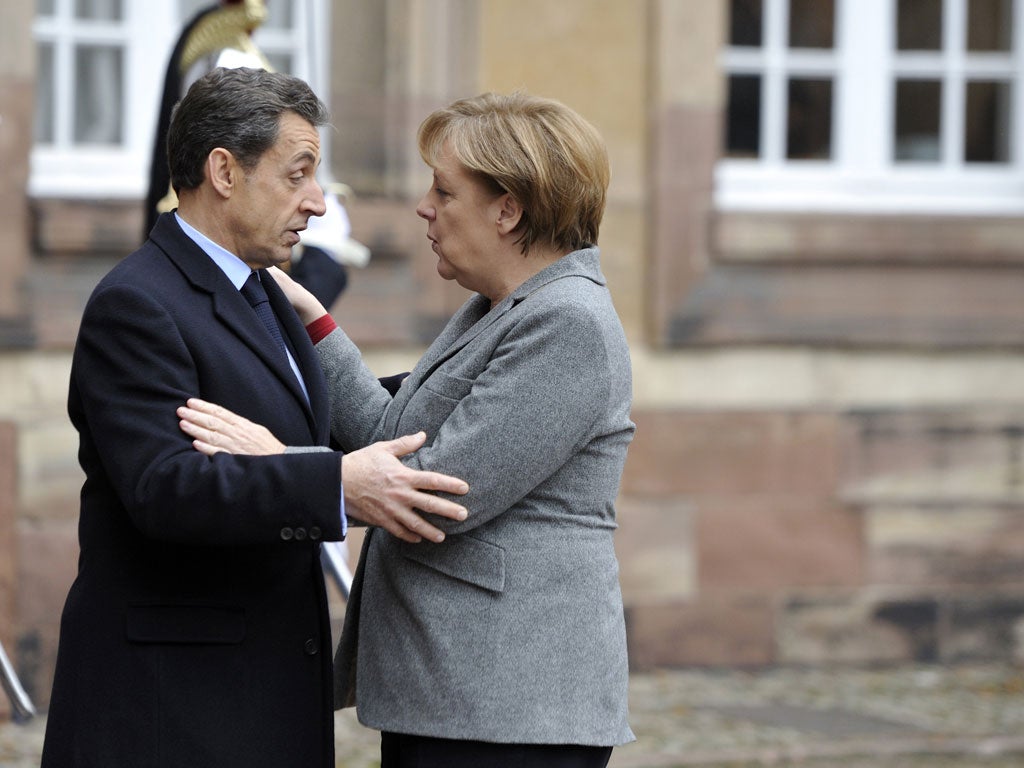 Sarkozy and Merkel at a european mini-summit with Italian Prime minister Mario Monti on the debt crisis, in November