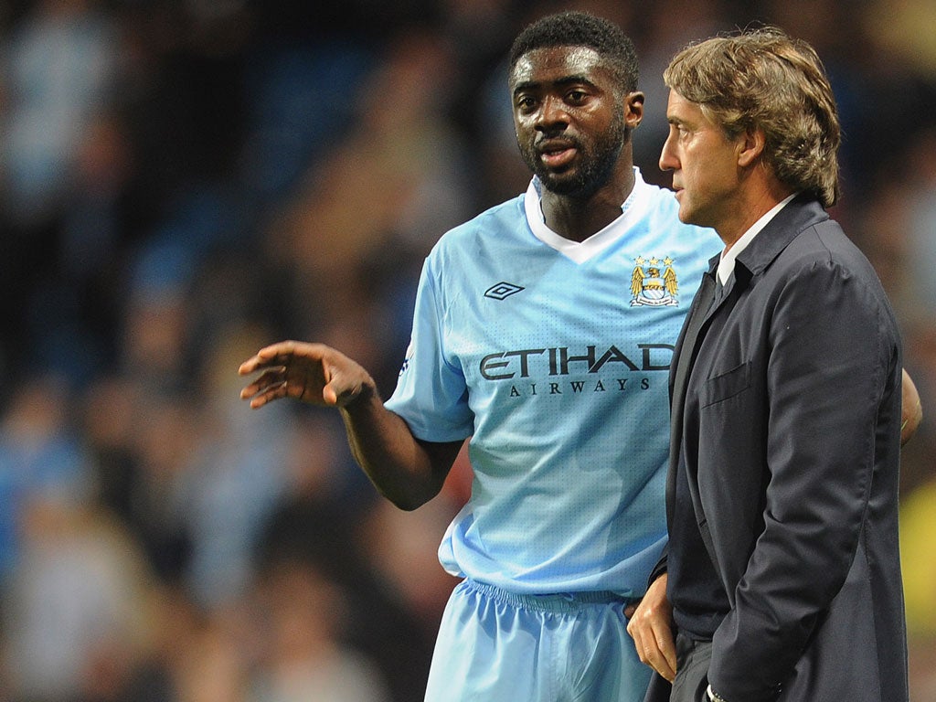 Touré and Mancini during a Carling Cup match against Birmingham City in September