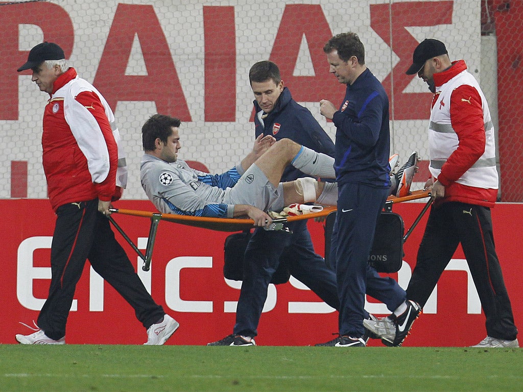 Arsenal's goalkeeper Lukasz Fabianski is carried from the pitch last night