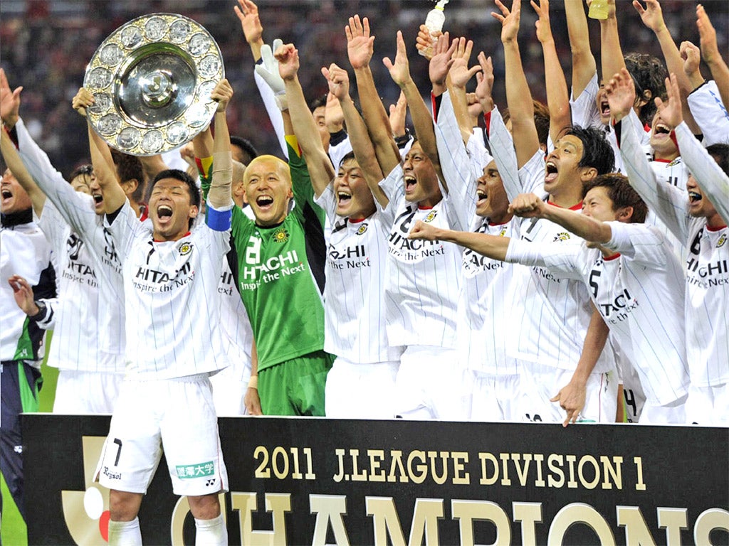 Jubilant Kashiwa Reysol players celebrate winning their first J-League title last weekend