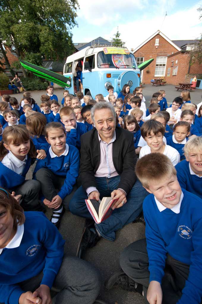 Frank Cottrell Boyce surrounded by pupils from St Peters Methodist Primary School in Canterbury