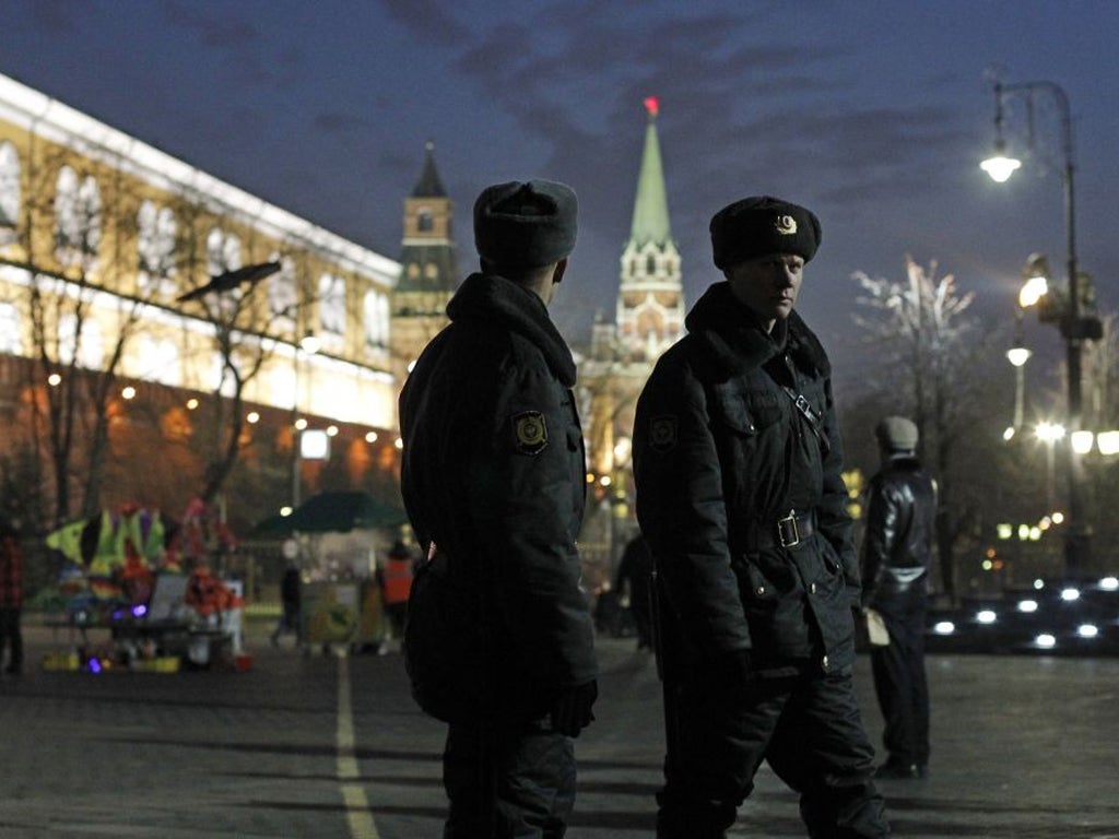 Police patrol on Manezhnaya square outside the Kremlin in Moscow. They plan to be out in force tomorow